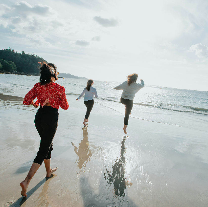 Women running on the beach